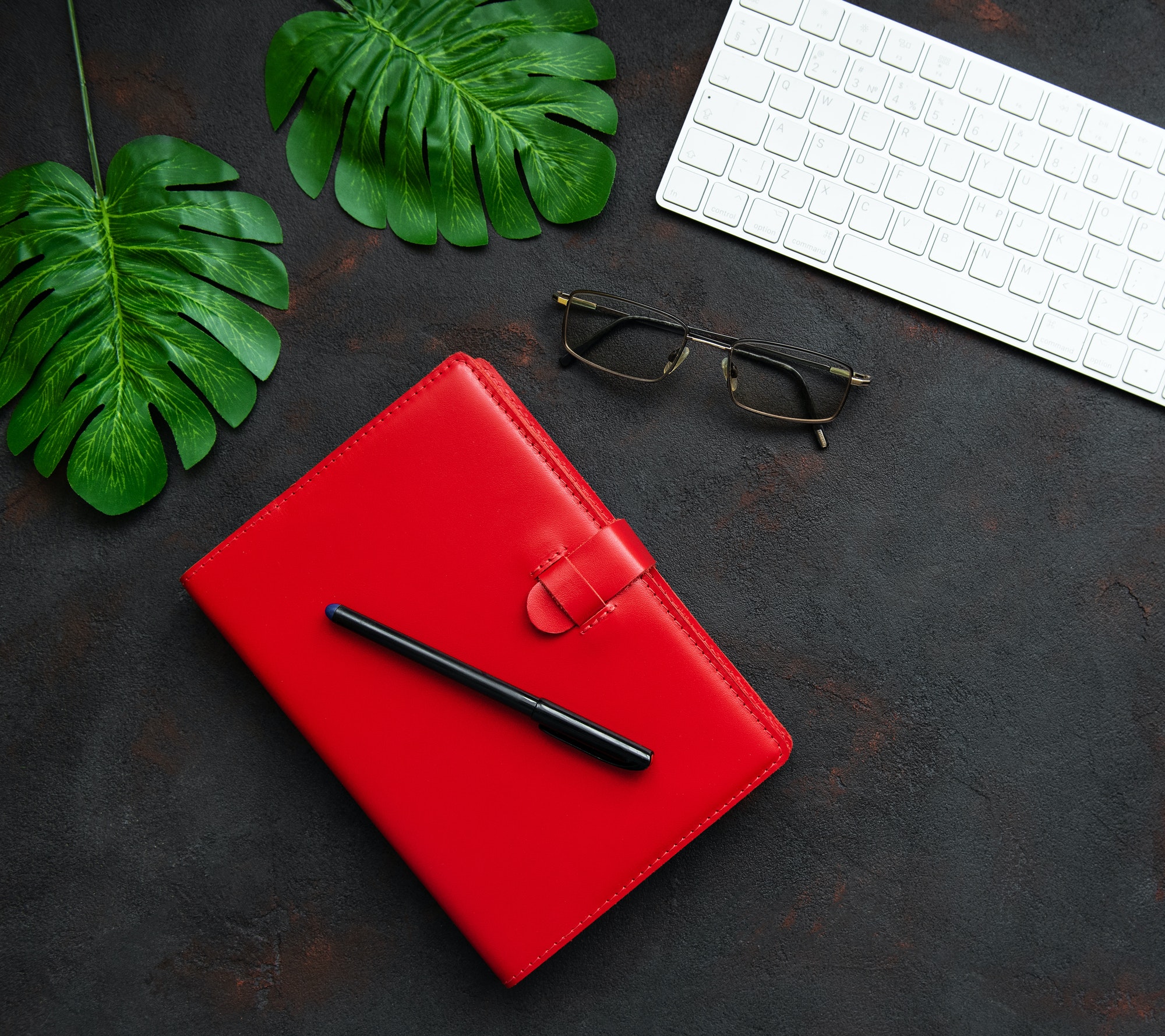Red notebook and keyboard